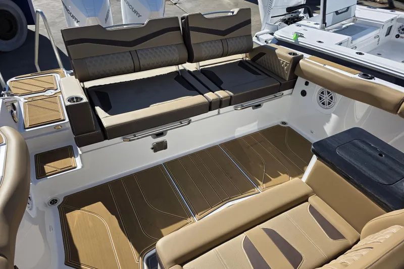  Yacht Photos Pics Luxurious interior of 2026 Monterey Elite 30 OB boat with tan seating and wood accents.
