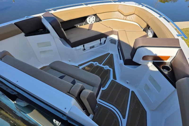  Yacht Photos Pics Luxurious interior of 2026 Monterey Elite 30 OB boat with brown seating and cup holders.