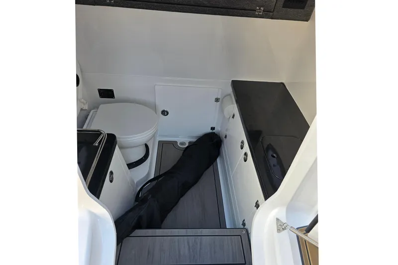  Yacht Photos Pics Interior of 2026 Monterey Elite 30 OB with toilet and storage.