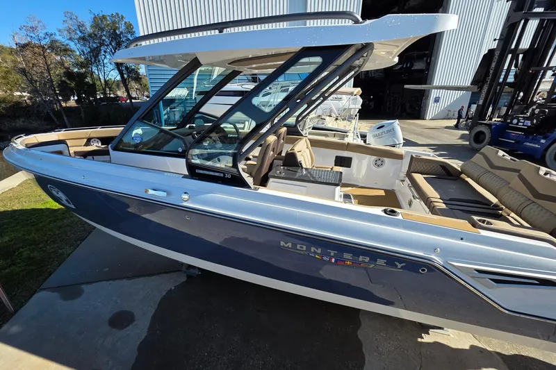 Yacht Photos Pics 2026 Monterey Elite 30 OB boat outdoors, side view.