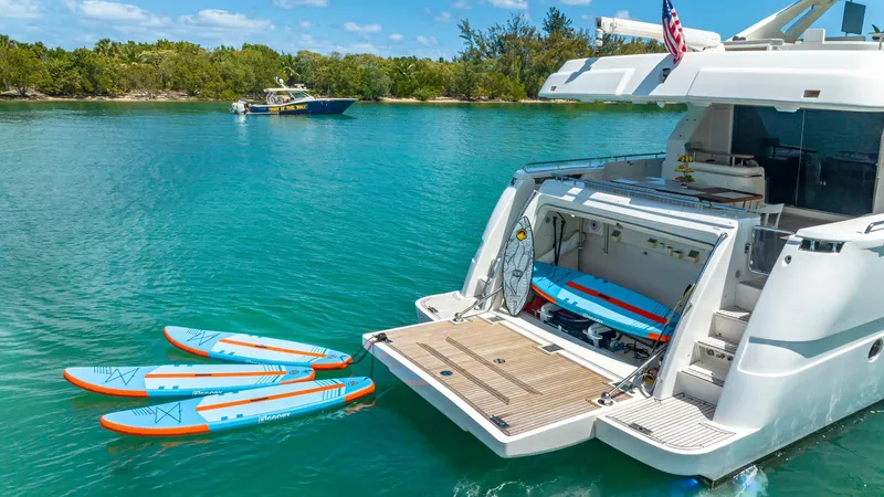 Hoya Saxa Yacht Photos Pics Luxury 2013 Ferretti Yachts 870 FLYBRIDGE with paddleboards in scenic waterway.