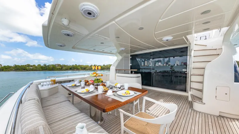 Hoya Saxa Yacht Photos Pics Luxurious dining area on 2013 Ferretti Yachts 870 FLYBRIDGE with scenic water view.