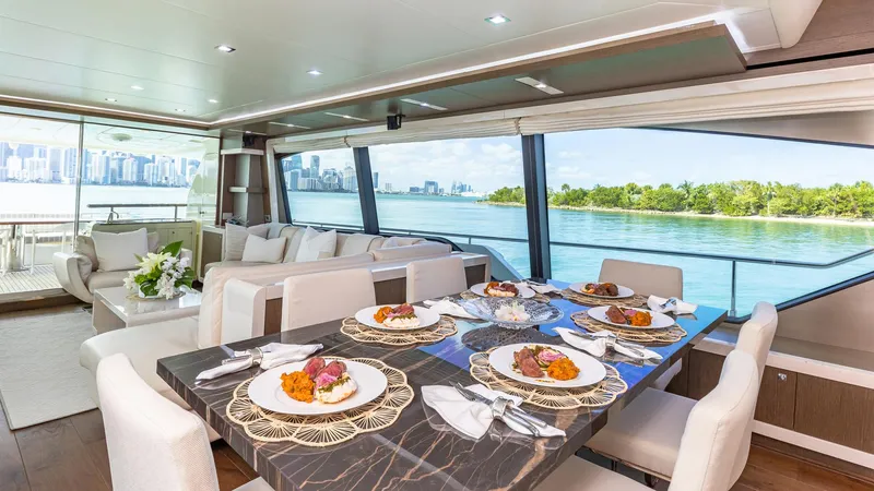 Hoya Saxa Yacht Photos Pics Luxurious dining area on 2013 Ferretti Yachts 870 FLYBRIDGE with scenic ocean view.