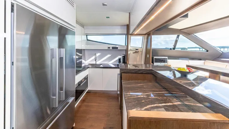 Hoya Saxa Yacht Photos Pics Luxurious kitchen interior of 2013 Ferretti Yachts 870 FLYBRIDGE with modern appliances and sleek design.