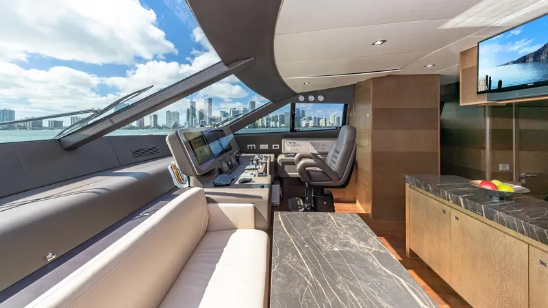 Hoya Saxa Yacht Photos Pics Luxurious interior of 2013 Ferretti Yachts 870 FLYBRIDGE with city skyline view.