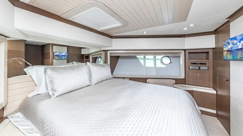 Hoya Saxa Yacht Photos Pics Luxurious bedroom interior of 2013 Ferretti Yachts 870 FLYBRIDGE with elegant bedding and modern design.