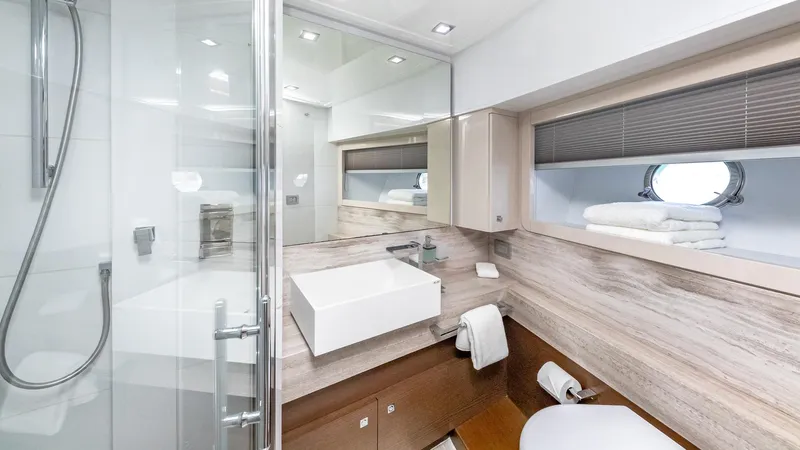 Hoya Saxa Yacht Photos Pics Luxurious bathroom on 2013 Ferretti Yachts 870 FLYBRIDGE with modern fixtures and elegant design.