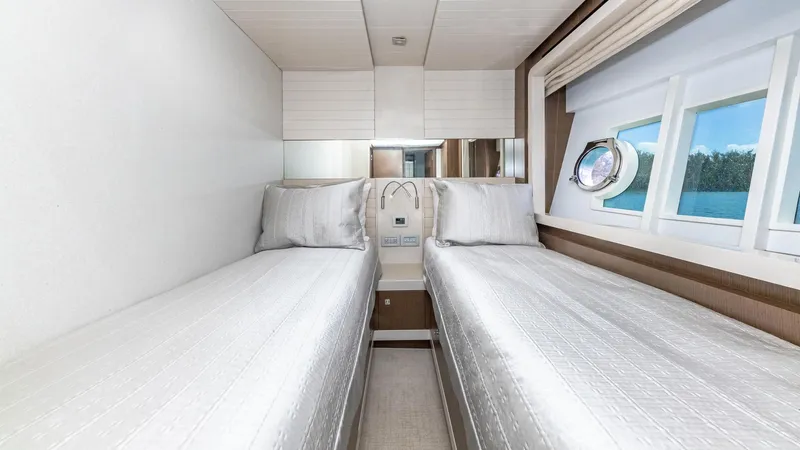 Hoya Saxa Yacht Photos Pics Twin beds in a luxurious 2013 Ferretti Yachts 870 FLYBRIDGE cabin with ocean view.
