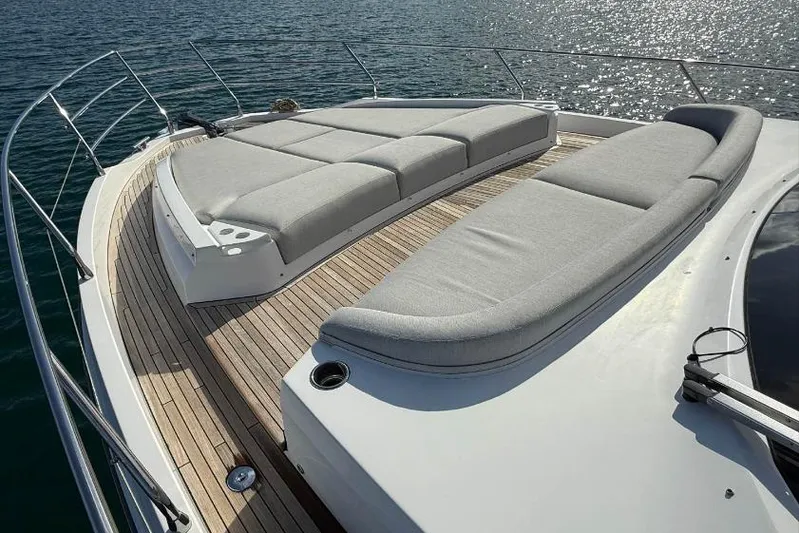  Yacht Photos Pics Luxurious 2022 Azimut Fly 53 yacht deck with elegant sun loungers on calm water.