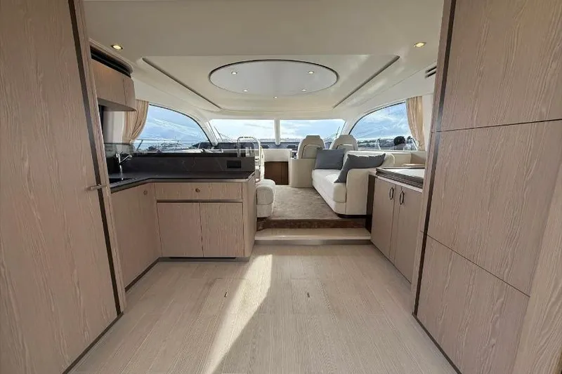  Yacht Photos Pics Luxurious interior of 2022 Azimut Fly 53 yacht with modern furnishings and panoramic windows.