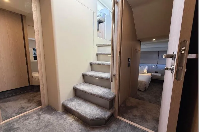  Yacht Photos Pics Interior of 2022 Azimut Fly 53 yacht with carpeted stairs and modern design.