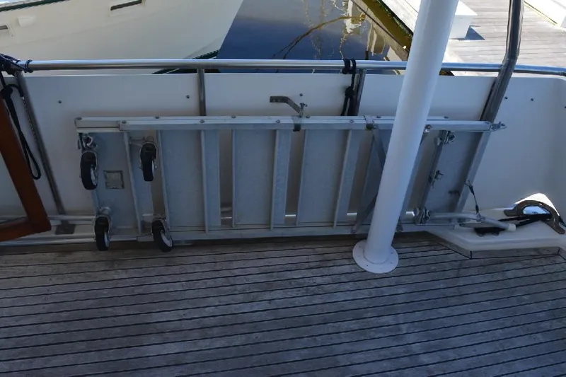 Aloha Yacht Photos Pics 1988 Marine Trader 47 Tradewinds yacht deck with folded boarding ladder.