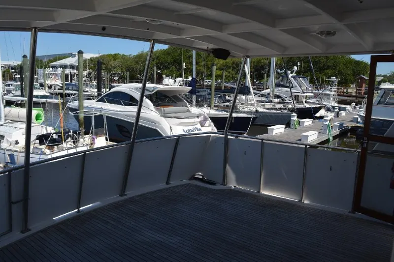 Aloha Yacht Photos Pics 1988 Marine Trader 47 Tradewinds yacht docked at marina, view from deck.