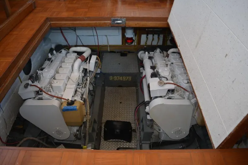 Aloha Yacht Photos Pics Engine room of 1988 Marine Trader 47 Tradewinds yacht, featuring dual engines.