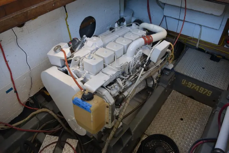 Aloha Yacht Photos Pics Engine room of 1988 Marine Trader 47 Tradewinds yacht, showcasing a well-maintained engine.