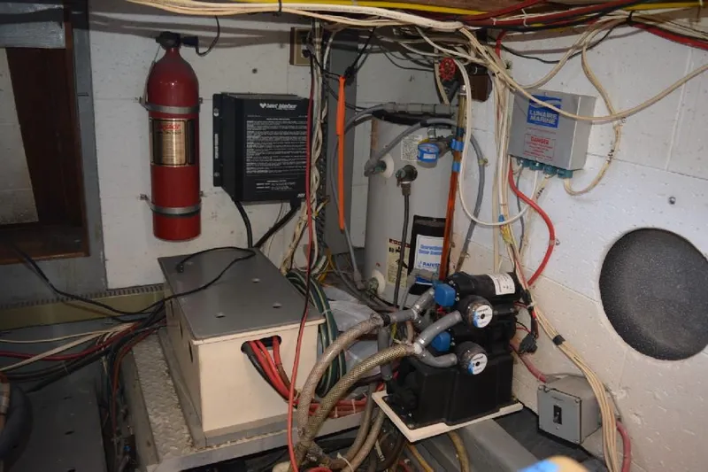 Aloha Yacht Photos Pics Engine room of 1988 Marine Trader 47 Tradewinds with wiring and equipment.