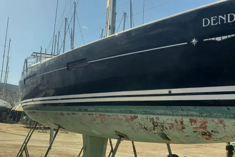  Yacht Photos Pics 2010 Jeanneau 53 sailboat on dry dock, showing hull and keel.