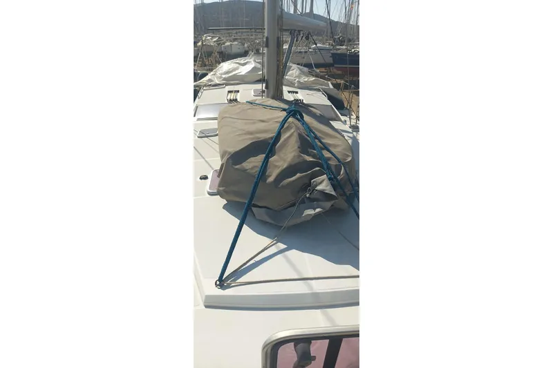  Yacht Photos Pics 2010 Jeanneau 53 yacht deck with covered equipment and blue ropes.