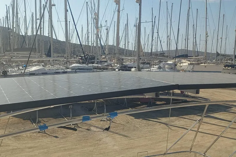  Yacht Photos Pics Jeanneau 53 sailboat with solar panels in a marina, 2010 model.