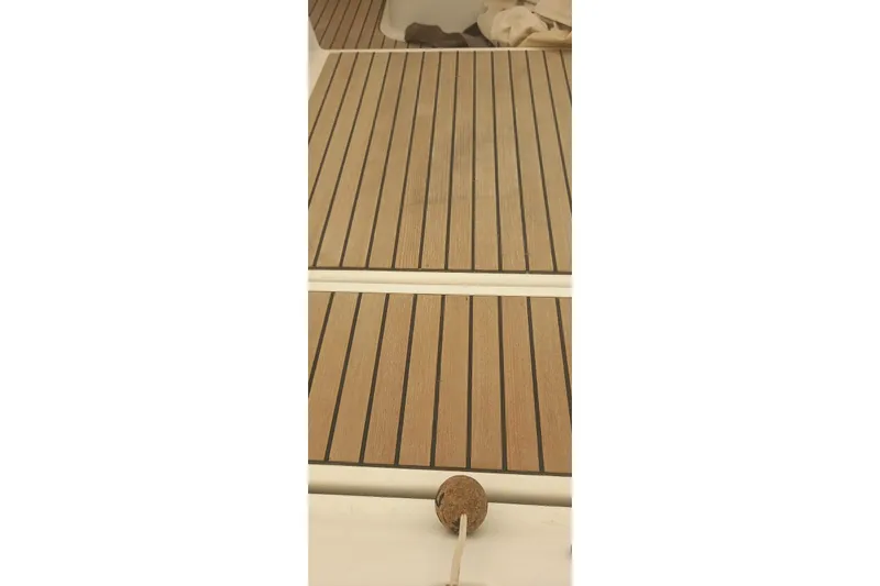  Yacht Photos Pics Teak deck of 2010 Jeanneau 53 sailboat, featuring clean lines and classic design.