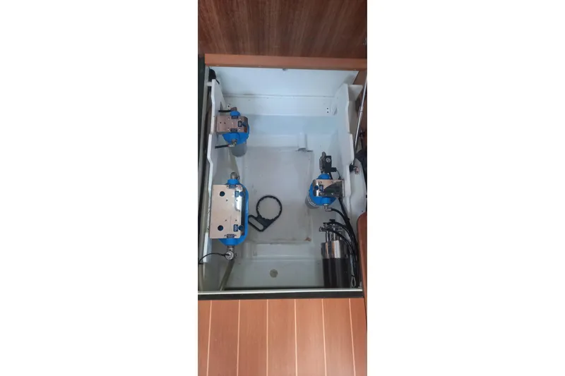  Yacht Photos Pics Engine compartment of a 2010 Jeanneau 53 sailboat, showcasing mechanical components.