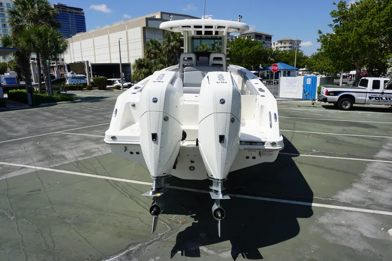 Bwce1064l324 Yacht Photos Pics 2024 Boston Whaler 330 Outrage with twin outboard engines, rear view in marina.