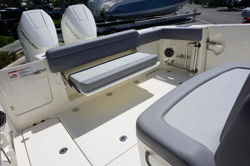 Bwce1064l324 Yacht Photos Pics 2024 Boston Whaler 330 Outrage boat interior with foldable seating and twin Mercury engines.