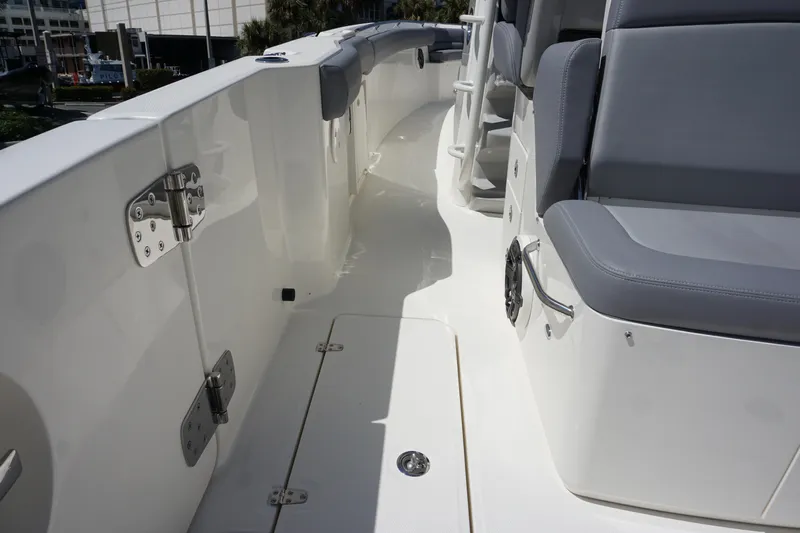 Bwce1064l324 Yacht Photos Pics 2024 Boston Whaler 330 Outrage boat deck with seating and storage compartments.