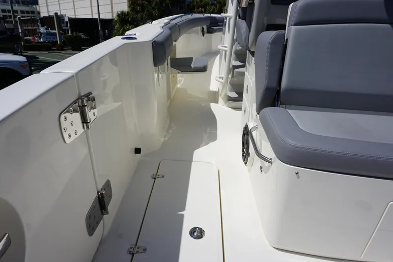 Bwce1064l324 Yacht Photos Pics 2024 Boston Whaler 330 Outrage boat deck with seating and storage compartments.