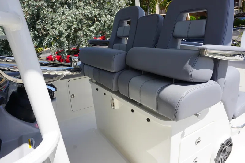 Bwce1064l324 Yacht Photos Pics 2024 Boston Whaler 330 Outrage boat seating area with cushioned seats.
