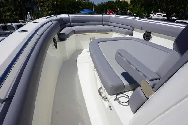 Bwce1064l324 Yacht Photos Pics 2024 Boston Whaler 330 Outrage boat interior with cushioned seating.