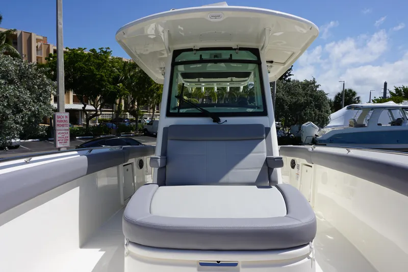 Bwce1064l324 Yacht Photos Pics 2024 Boston Whaler 330 Outrage boat interior with cushioned seating.