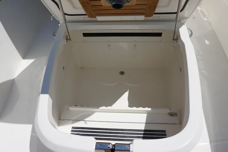 Bwce1064l324 Yacht Photos Pics Open storage compartment on a 2024 Boston Whaler 330 Outrage boat.