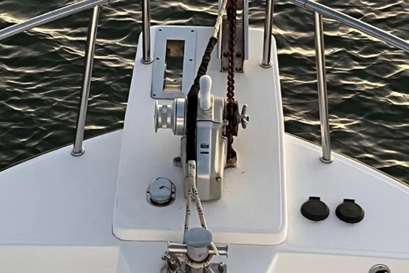 Egret Yacht Photos Pics Bow Pulpit of 2005 Nordic Tug 37 Flybridge with anchor winch, 2 chutes, Samson post, foot controls and stainless steel railing