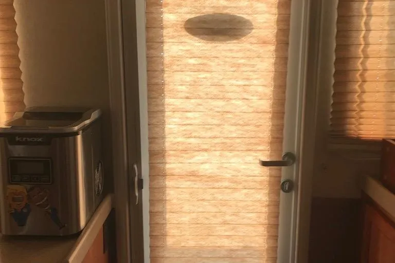 Egret Yacht Photos Pics Interior of 2005 Nordic Tug 37 Flybridge with blinds and countertop appliance.