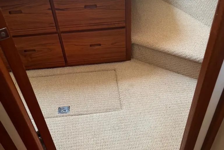 Egret Yacht Photos Pics 2005 Nordic Tug 37 Flybridge interior with carpeted floor and wooden cabinetry.