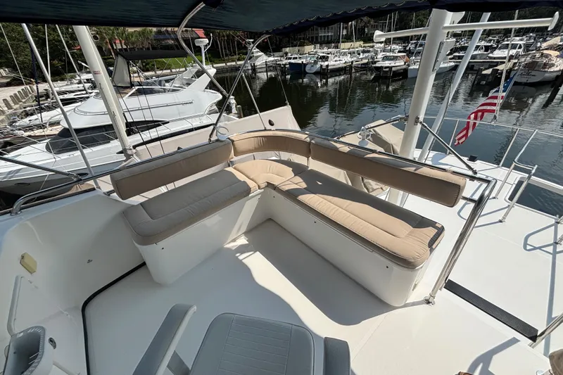 Egret Yacht Photos Pics L-Shaped Seating on Upper Deck of 2005 Nordic Tug 37 Flybridge with storage below