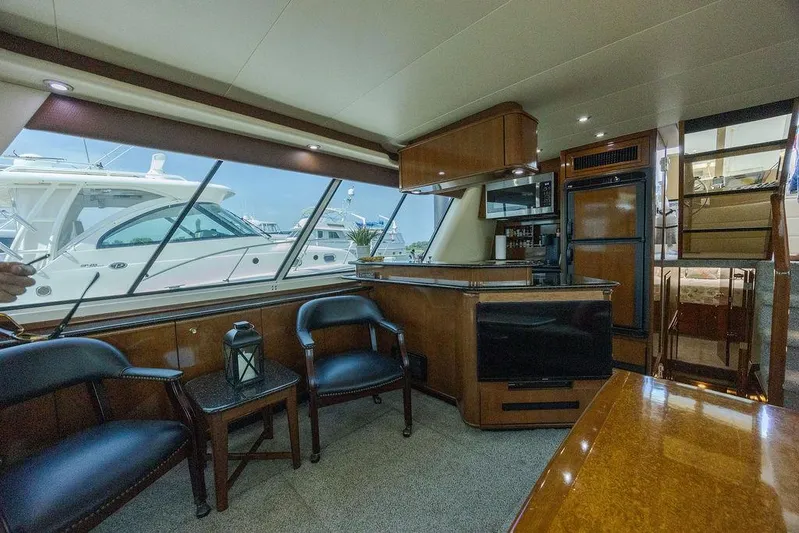  Yacht Photos Pics Interior of 2008 Meridian 490 Pilothouse yacht with seating and kitchenette.