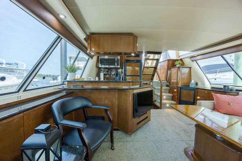  Yacht Photos Pics Luxurious interior of 2008 Meridian 490 Pilothouse yacht with modern amenities and elegant design.