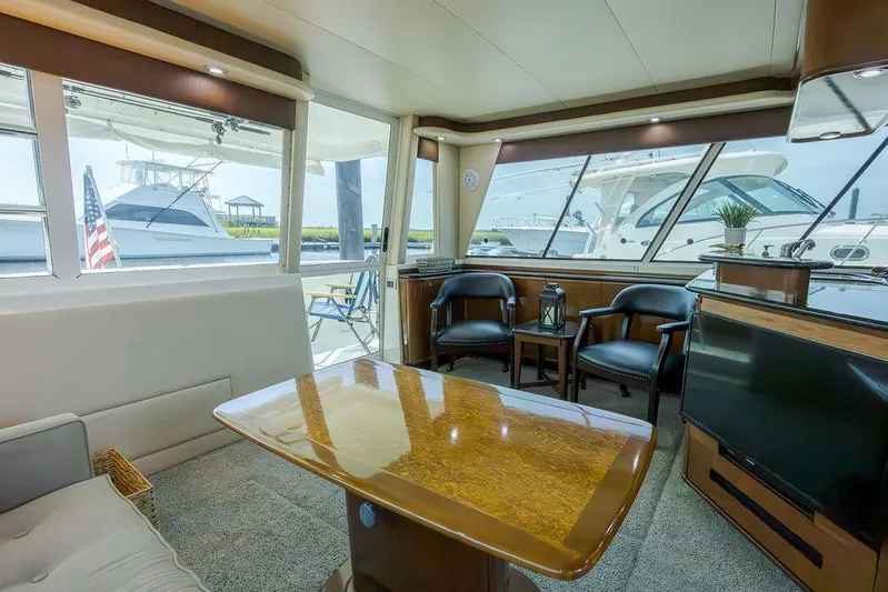  Yacht Photos Pics Interior of 2008 Meridian 490 Pilothouse yacht with elegant seating and large windows.