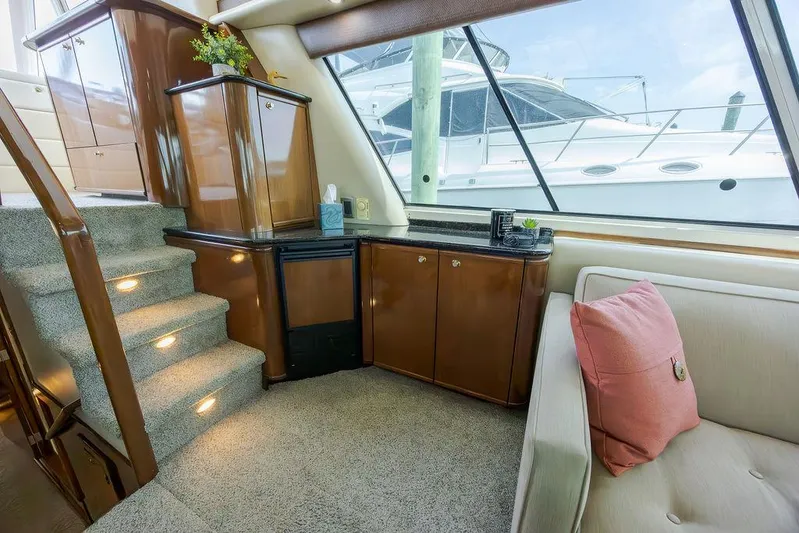  Yacht Photos Pics Interior of 2008 Meridian 490 Pilothouse yacht with elegant wood cabinetry and plush seating.