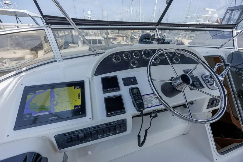  Yacht Photos Pics 2008 Meridian 490 Pilothouse helm with navigation display, steering wheel, and control panel.