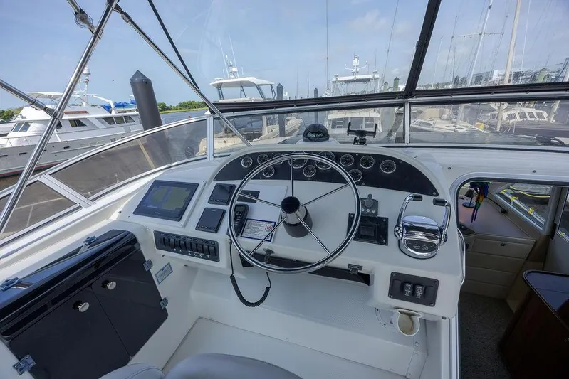  Yacht Photos Pics 2008 Meridian 490 Pilothouse helm with navigation equipment and steering wheel.