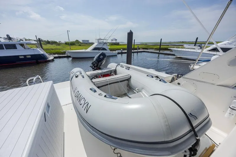  Yacht Photos Pics 2008 Meridian 490 Pilothouse with inflatable dinghy docked at marina.
