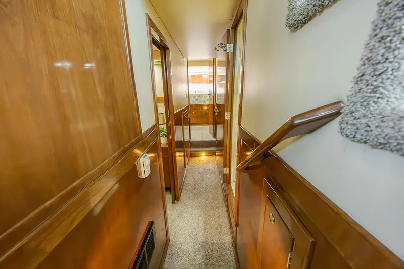 Yacht Photos Pics Hallway inside 2008 Meridian 490 Pilothouse yacht with wooden paneling and carpeted floor.
