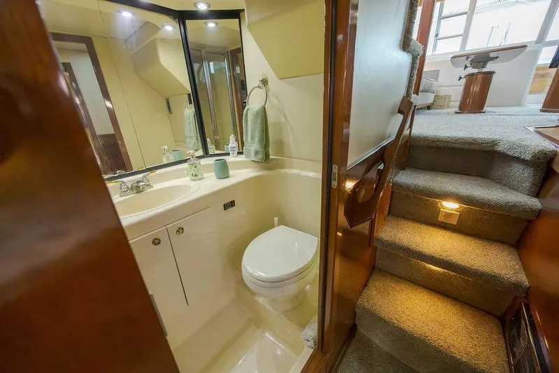  Yacht Photos Pics Bathroom and carpeted stairs inside 2008 Meridian 490 Pilothouse yacht.