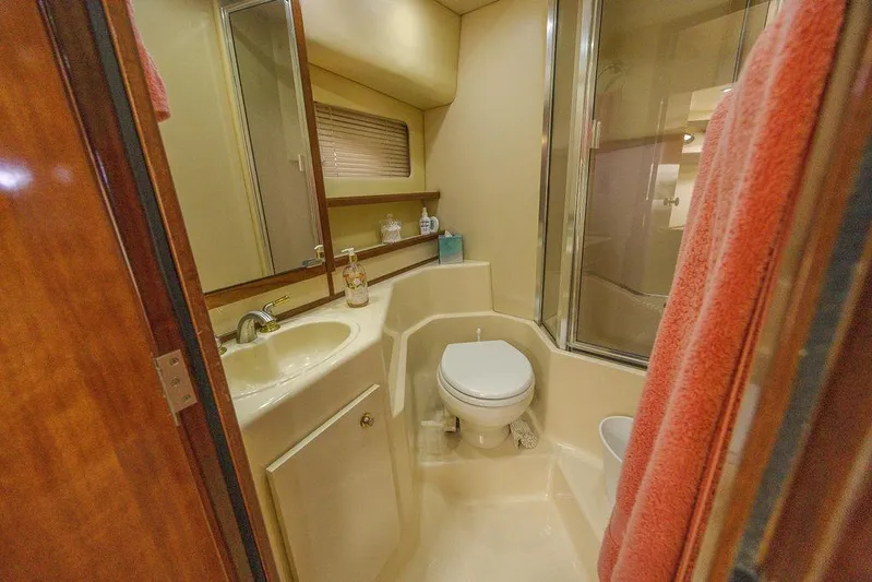  Yacht Photos Pics Bathroom interior of 2008 Meridian 490 Pilothouse yacht, featuring sink, toilet, and shower.
