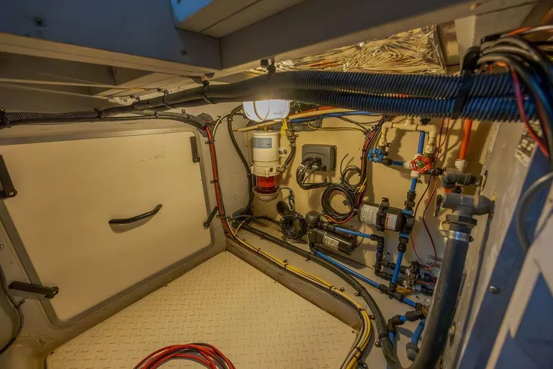  Yacht Photos Pics Engine room of 2008 Meridian 490 Pilothouse, showcasing wiring and plumbing systems.