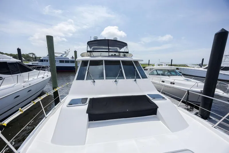  Yacht Photos Pics 2008 Meridian 490 Pilothouse yacht docked at marina under clear sky.