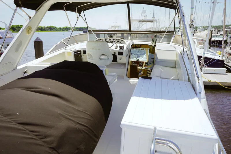  Yacht Photos Pics 2008 Meridian 490 Pilothouse yacht interior with helm, seating, and covered equipment.